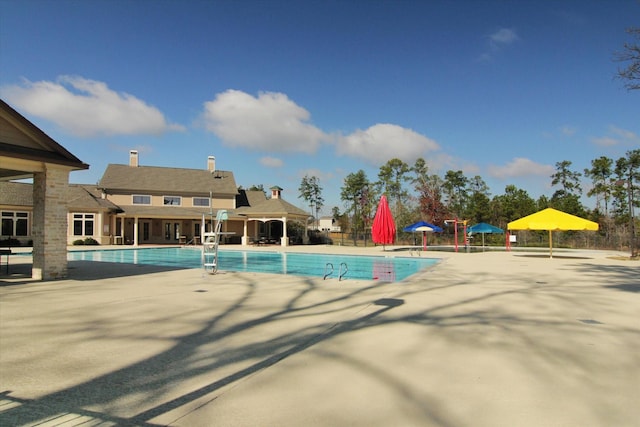 31703 Morning Ridge Ln, Spring, TX 77386 - community pool with a patio area