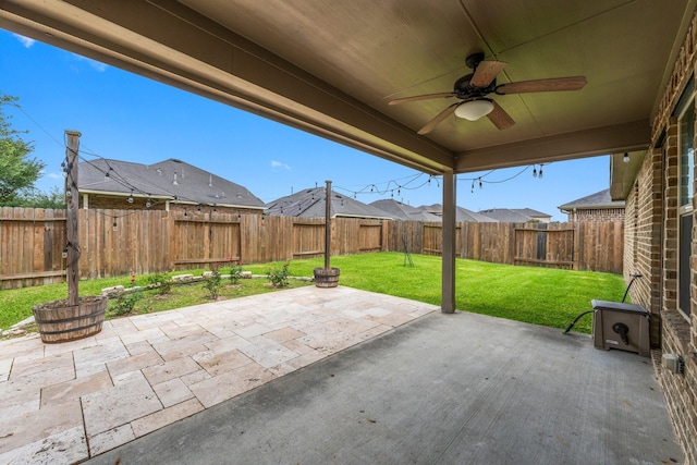 31703 Morning Ridge Ln, Spring, TX 77386 - fenced backyard with a patio area and ceiling fan