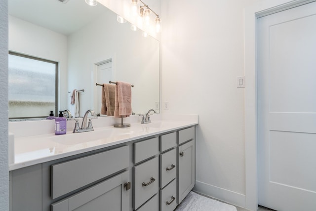 17746 Tree Of Heaven, Conroe, TX 77385 - bathroom featuring double vanity and baseboards