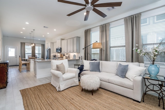 17746 Tree Of Heaven, Conroe, TX 77385 - living area featuring ceiling fan, recessed lighting, and light wood-style floors