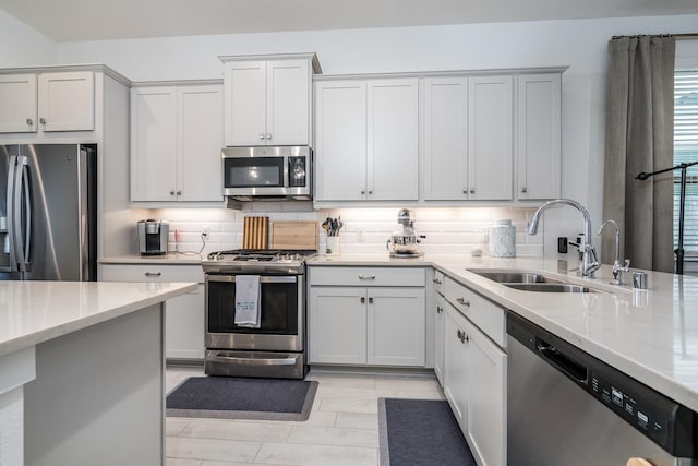 17746 Tree Of Heaven, Conroe, TX 77385 - kitchen with stainless steel appliances, light stone countertops, tasteful backsplash, and white cabinets