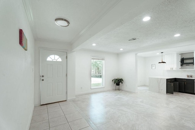28926 Twisted Oak Dr, Shenandoah, TX 77381 - entryway with plenty of natural light, crown molding, a textured ceiling, and recessed lighting