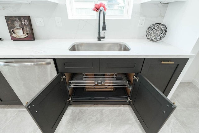 28926 Twisted Oak Dr, Shenandoah, TX 77381 - kitchen view of light stone countertops and stainless steel dishwasher