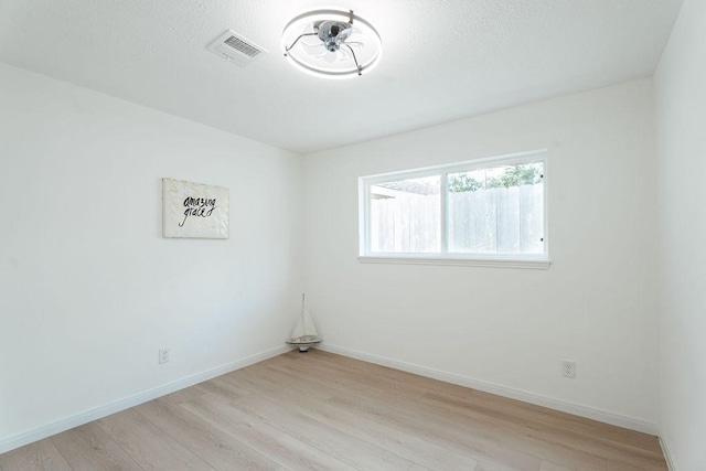 28926 Twisted Oak Dr, Shenandoah, TX 77381 - unfurnished room featuring light wood finished floors and baseboards
