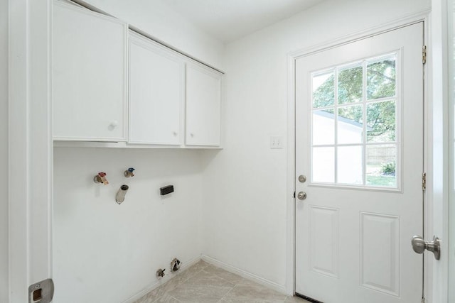 28926 Twisted Oak Dr, Shenandoah, TX 77381 - laundry room featuring cabinet space, plenty of natural light, electric dryer hookup, and hookup for a washing machine