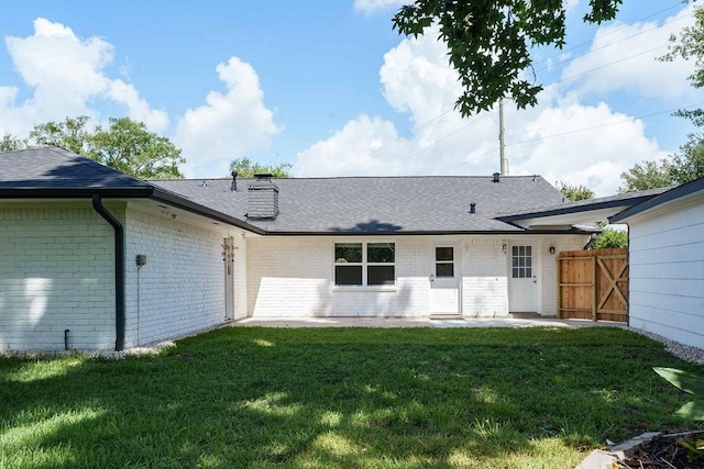 28926 Twisted Oak Dr, Shenandoah, TX 77381 - rear view of house featuring brick siding, a patio, a shingled roof, and a chimney