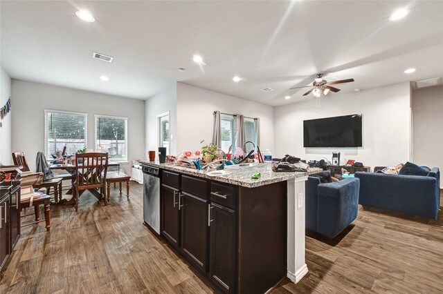 2435 Palmer Lake Ln, Spring, TX 77373 - kitchen featuring open floor plan, wood finished floors, dishwasher, recessed lighting, and light stone counters