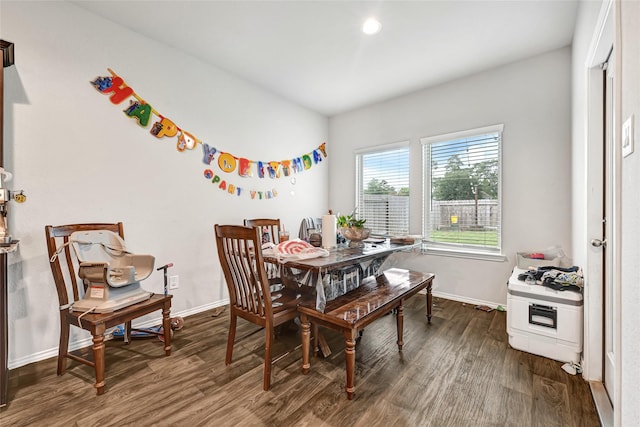 2435 Palmer Lake Ln, Spring, TX 77373 - dining space featuring dark wood-style flooring and baseboards