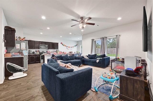 2435 Palmer Lake Ln, Spring, TX 77373 - living area with light wood-style floors, ceiling fan, and recessed lighting