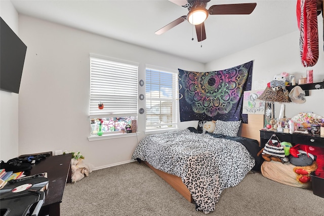 2435 Palmer Lake Ln, Spring, TX 77373 - carpeted bedroom with baseboards and ceiling fan