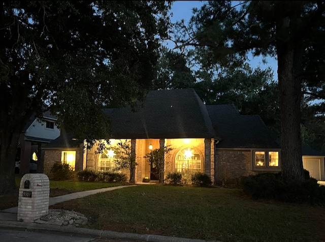 8819 W Rayford Rd, Tomball, TX 77375 - view of front facade with a front yard and stone siding