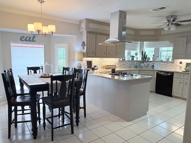 8819 W Rayford Rd, Tomball, TX 77375 - kitchen featuring black appliances, island exhaust hood, a peninsula, decorative backsplash, and a textured ceiling