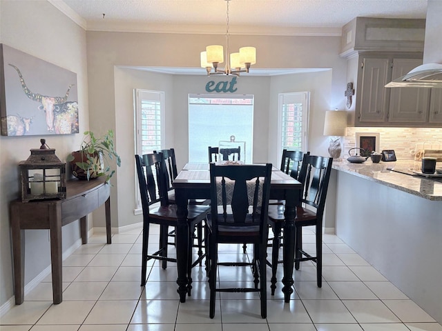 8819 W Rayford Rd, Tomball, TX 77375 - dining room featuring a chandelier, ornamental molding, and light tile patterned floors