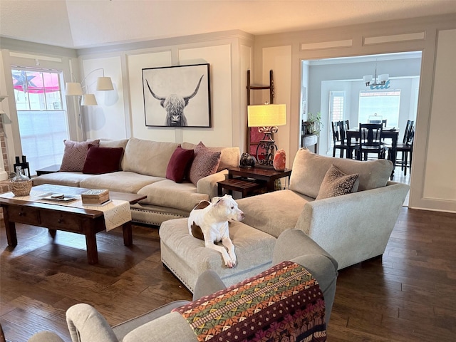 8819 W Rayford Rd, Tomball, TX 77375 - living room featuring a chandelier and dark wood-style flooring