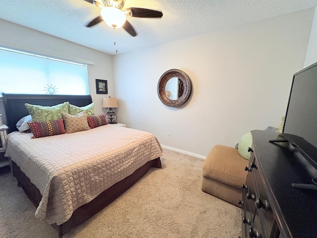 8819 W Rayford Rd, Tomball, TX 77375 - carpeted bedroom featuring ceiling fan and a textured ceiling