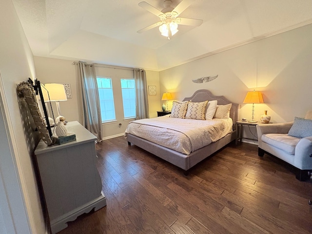 8819 W Rayford Rd, Tomball, TX 77375 - bedroom with a tray ceiling, dark wood-type flooring, and a ceiling fan