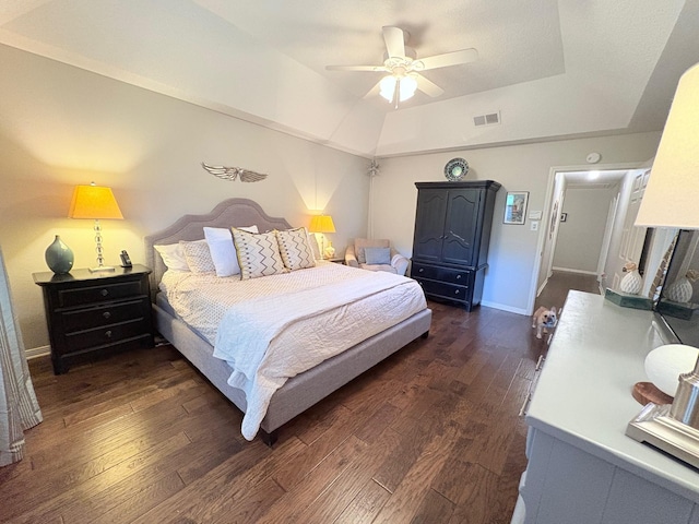 8819 W Rayford Rd, Tomball, TX 77375 - bedroom featuring dark wood-style floors, a tray ceiling, and ceiling fan