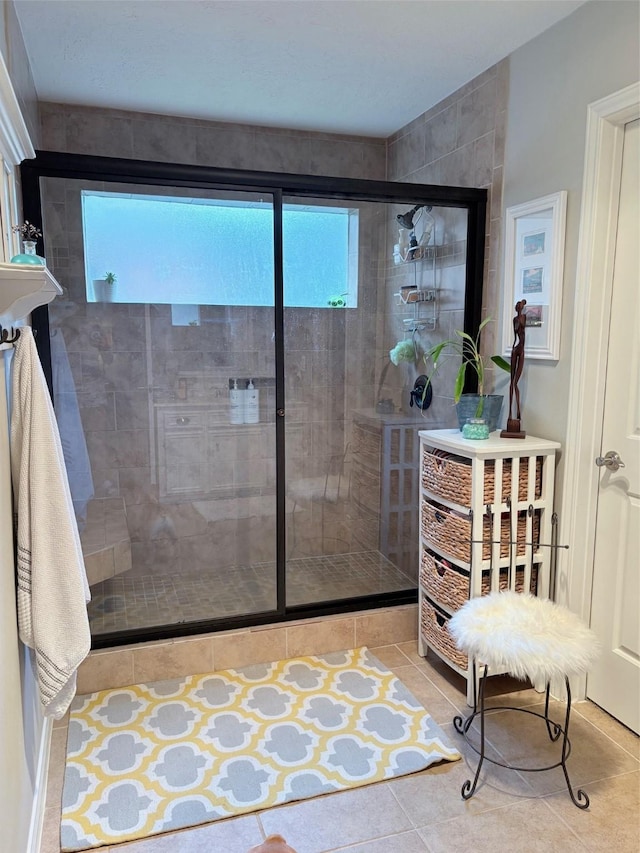 8819 W Rayford Rd, Tomball, TX 77375 - bathroom featuring a stall shower and tile patterned floors