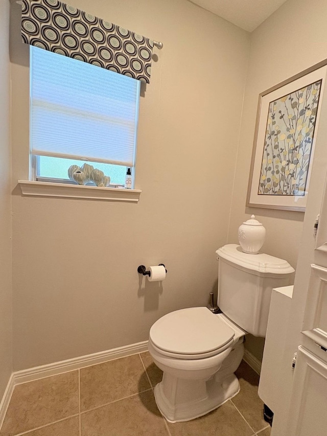8819 W Rayford Rd, Tomball, TX 77375 - bathroom featuring tile patterned floors and baseboards