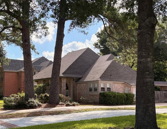 8819 W Rayford Rd, Tomball, TX 77375 - view of front of house with brick siding and roof with shingles