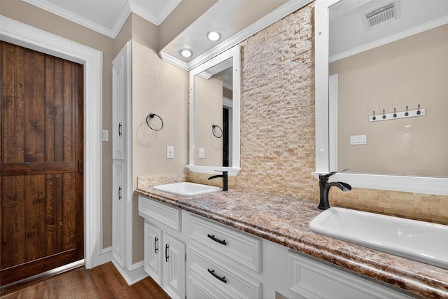 5903 Havenwoods Dr, Houston, TX 77066 - bathroom featuring double vanity, wood finished floors, and ornamental molding