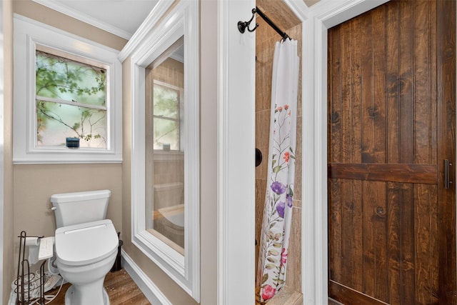 5903 Havenwoods Dr, Houston, TX 77066 - bathroom with ornamental molding, curtained shower, and wood finished floors