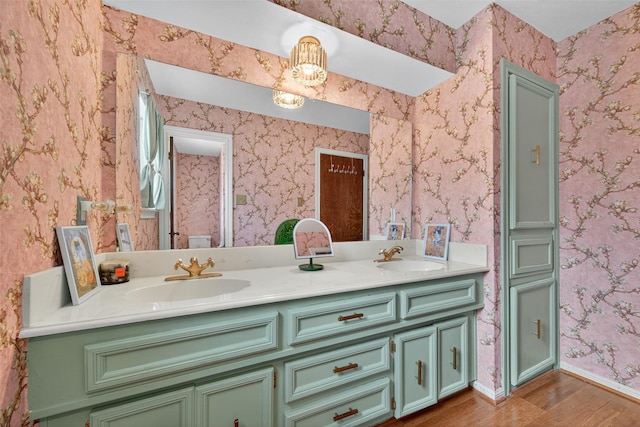 5903 Havenwoods Dr, Houston, TX 77066 - full bathroom with wood finished floors, double vanity, and wallpapered walls