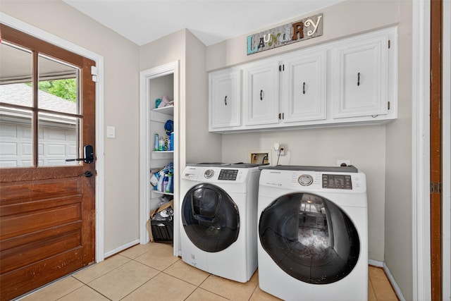 5903 Havenwoods Dr, Houston, TX 77066 - laundry area with cabinet space, light tile patterned floors, and washer and dryer
