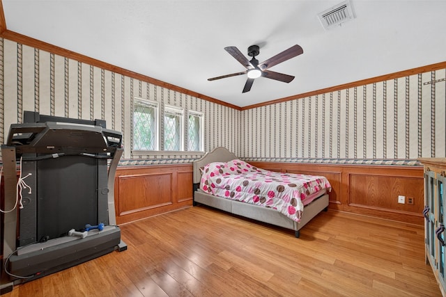5903 Havenwoods Dr, Houston, TX 77066 - bedroom featuring wallpapered walls, light wood-type flooring, ornamental molding, and ceiling fan
