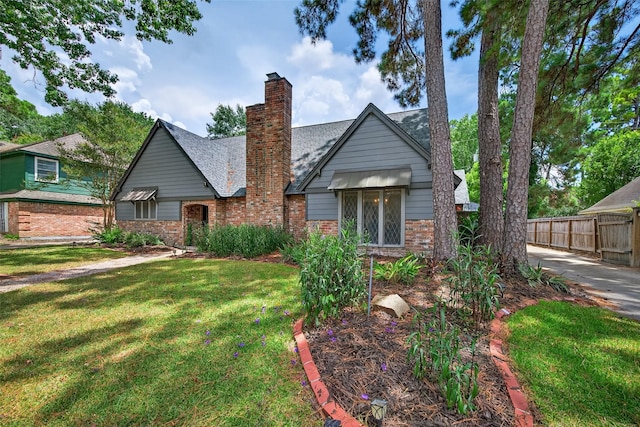 5903 Havenwoods Dr, Houston, TX 77066 - view of front of property with brick siding and a chimney