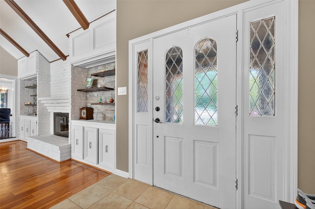 5903 Havenwoods Dr, Houston, TX 77066 - entrance foyer with light wood-type flooring and a fireplace