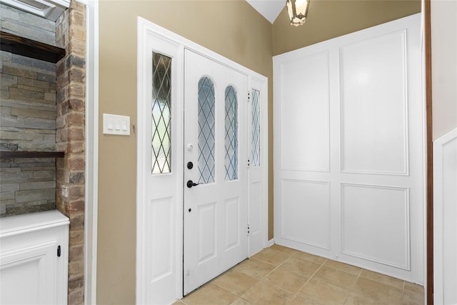5903 Havenwoods Dr, Houston, TX 77066 - entryway with light tile patterned floors and vaulted ceiling