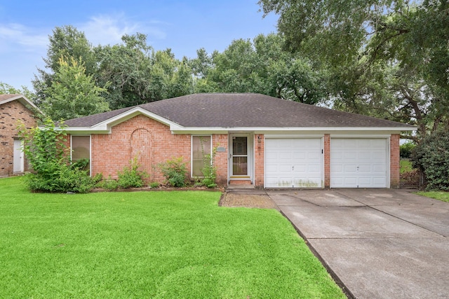2121 Redwood St, Kemah, TX 77565 - ranch-style house featuring concrete driveway, a garage, a front lawn, and brick siding