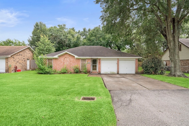 2121 Redwood St, Kemah, TX 77565 - ranch-style house featuring brick siding, an attached garage, concrete driveway, and roof with shingles