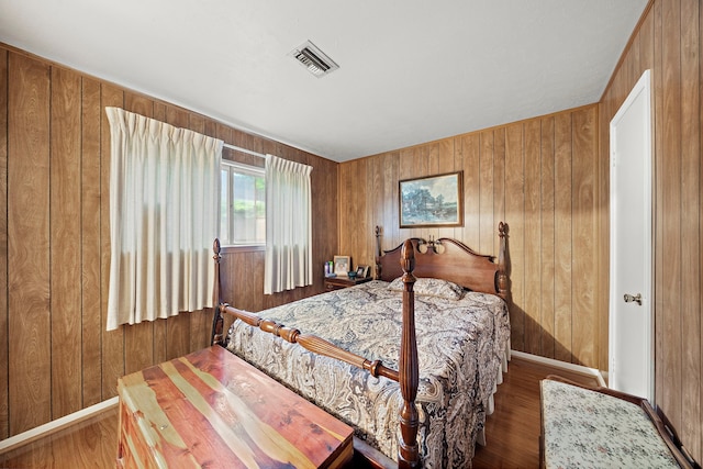 2121 Redwood St, Kemah, TX 77565 - bedroom featuring wood walls and wood finished floors