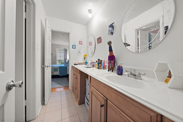 2121 Redwood St, Kemah, TX 77565 - ensuite bathroom featuring double vanity and tile patterned flooring