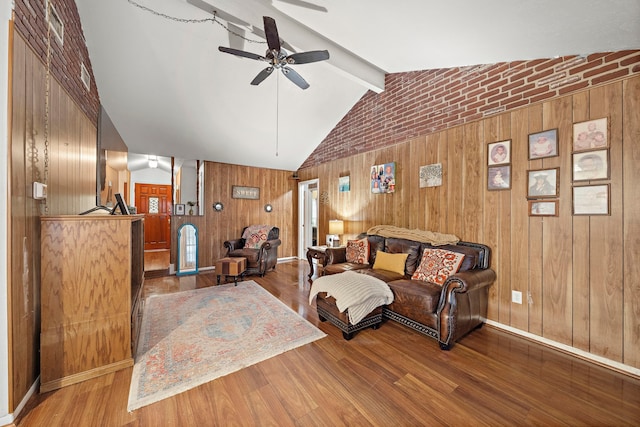 2121 Redwood St, Kemah, TX 77565 - living area featuring a ceiling fan, wooden walls, and wood finished floors