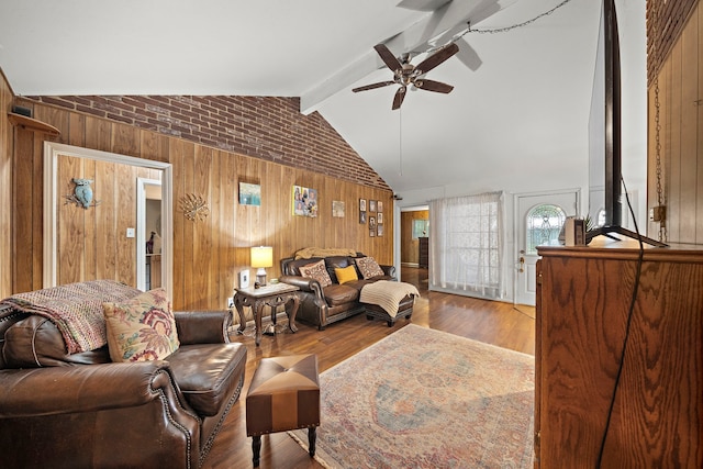 2121 Redwood St, Kemah, TX 77565 - living room with wooden walls, ceiling fan, and wood finished floors