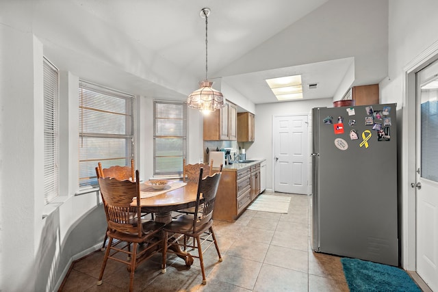 2121 Redwood St, Kemah, TX 77565 - dining space featuring light tile patterned floors and lofted ceiling