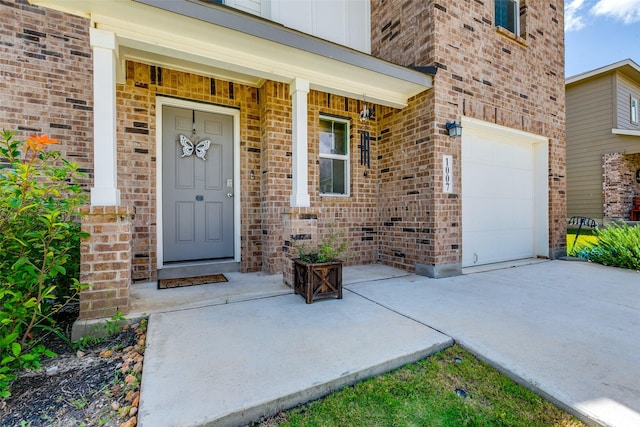 1007 Cozumel Emerald, San Antonio, TX 78253 - property entrance with brick siding, an attached garage, covered porch, and driveway