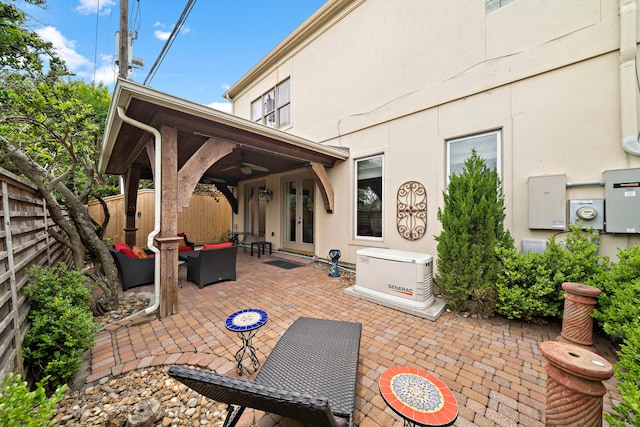 1229 Ripple Creek Dr, Houston, TX 77057 - fenced backyard featuring ceiling fan, outdoor lounge area, a patio, and french doors