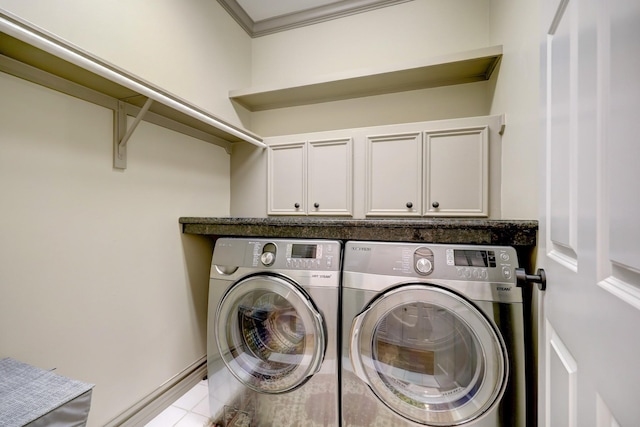 1229 Ripple Creek Dr, Houston, TX 77057 - washroom with washer and clothes dryer, cabinet space, ornamental molding, and tile patterned flooring