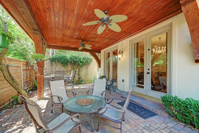1229 Ripple Creek Dr, Houston, TX 77057 - fenced backyard with outdoor dining space, french doors, a ceiling fan, and a patio area