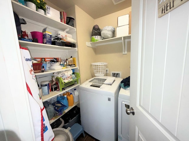 2315 Shady Tree Ln, Conroe, TX 77301 - laundry room with washing machine and clothes dryer