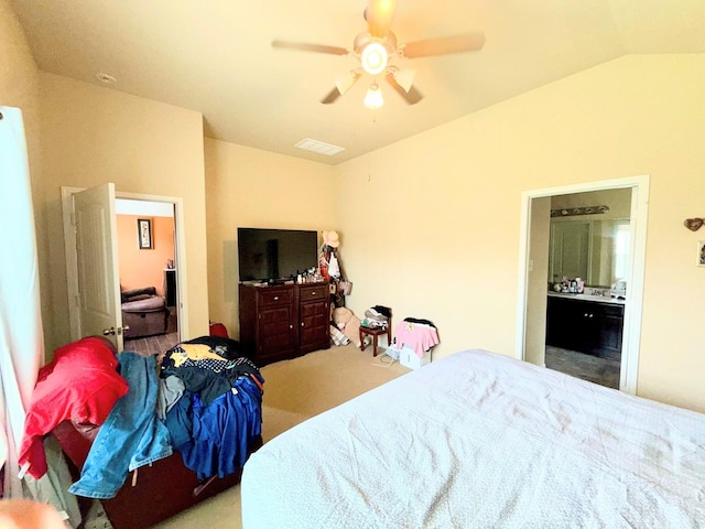 2315 Shady Tree Ln, Conroe, TX 77301 - carpeted bedroom featuring lofted ceiling, ensuite bathroom, and ceiling fan