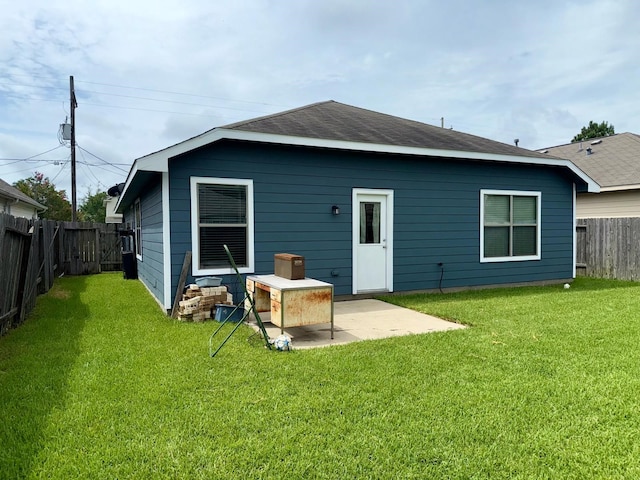 2315 Shady Tree Ln, Conroe, TX 77301 - rear view of property featuring a fenced backyard, a patio, and roof with shingles