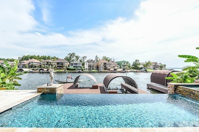 12349 Tramonto Dr, Conroe, TX 77304 - view of pool with a residential view, a water view, and a dock