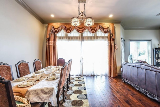 12349 Tramonto Dr, Conroe, TX 77304 - dining room featuring crown molding, dark wood-style floors, and a chandelier