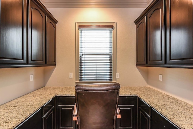 12349 Tramonto Dr, Conroe, TX 77304 - kitchen with crown molding, light stone counters, and dark brown cabinets