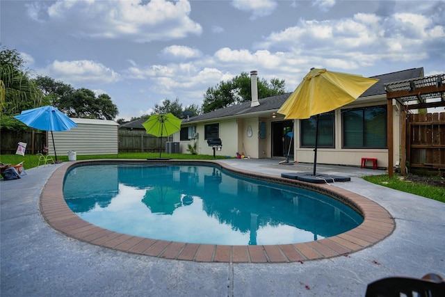 1103 W Brompton Dr, Pearland, TX 77584 - view of pool with a patio area
